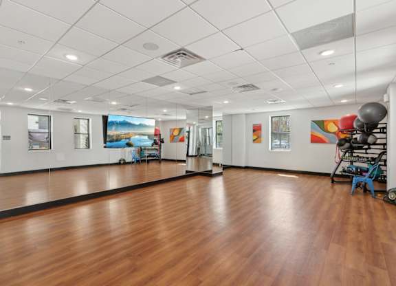 A room with wooden floors and white walls.