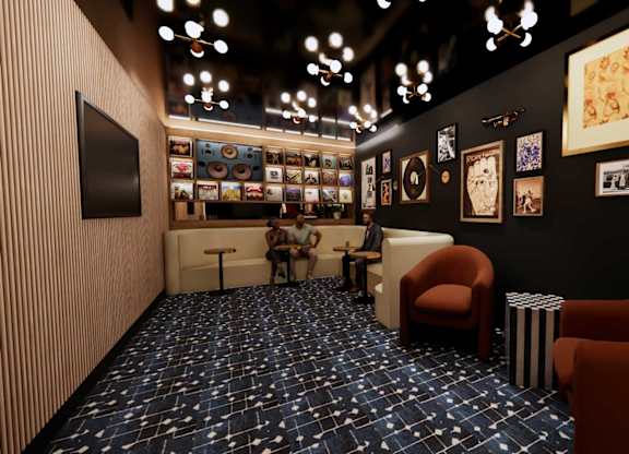 A room with a blue carpet and a black wall with pictures.