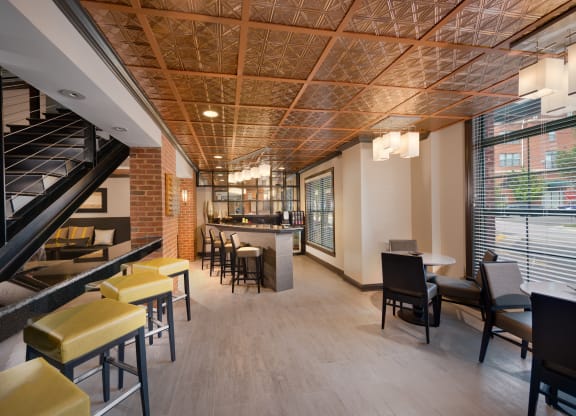 Stylish Resident Lounge with Fireplace, Wet Bar, and Plush Seating Areas at The Cosmopolitan at Lorton Station, Lorton, VA