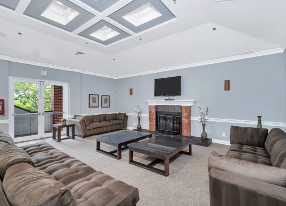 a living room filled with furniture and a fireplace