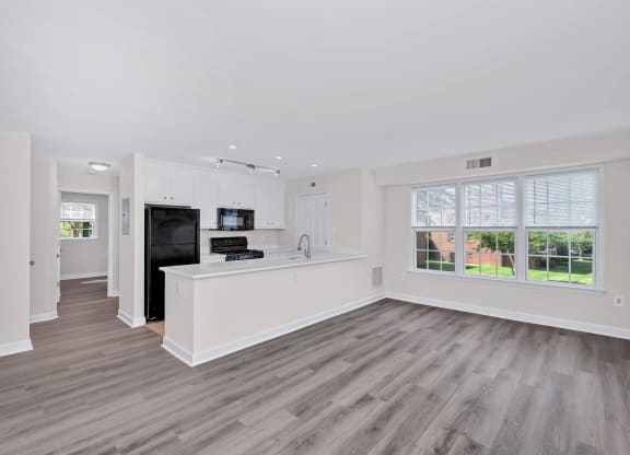 a kitchen and living room in a 555 waverly unit