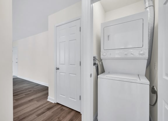a room with a washer and dryer in it