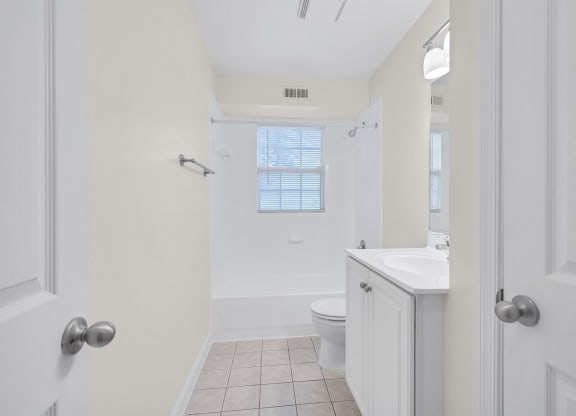a bathroom with a toilet sink and bathtub