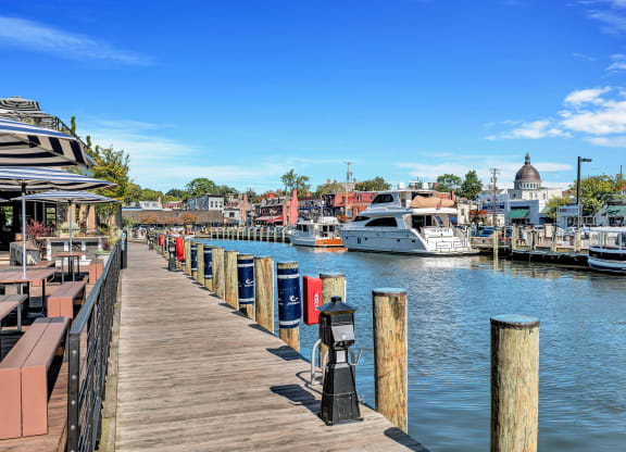 a dock with boats docked in the water at a marina