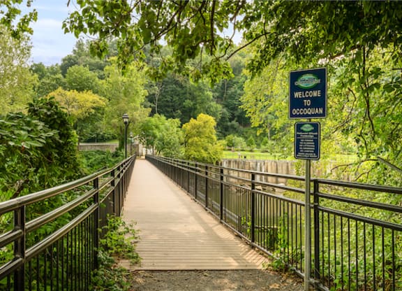 a bridge with a sign that says welcome to brooklyn