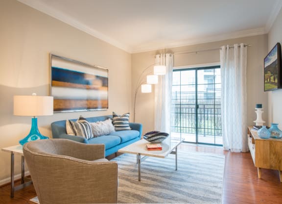 Spacious living areas with hardwood flooring at The Cosmopolitan at Lorton Station, Lorton