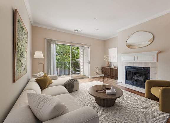 A living room with a fireplace and a painting on the wall.