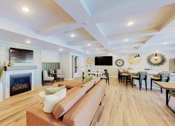 A living room with a fireplace and a couch.