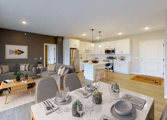 A modern dining room with a wooden table set for two.