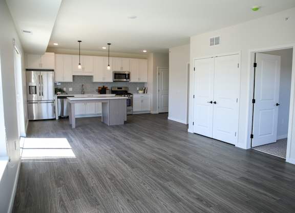 a kitchen and living room in an apartment