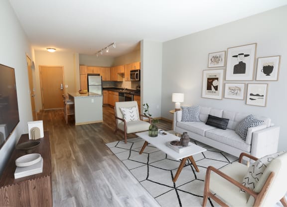 a living room and kitchen in a two bedroom apartment