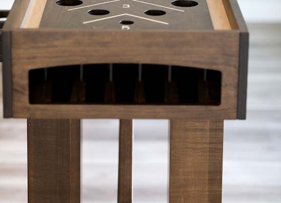 a close up of the shuffleboard table