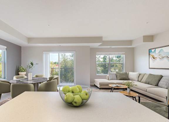 A dining table with a bowl of green apples on it.