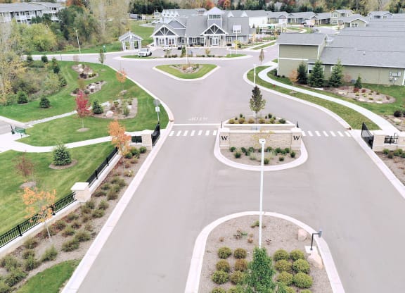 an aerial view of a neighborhood with a street and houses