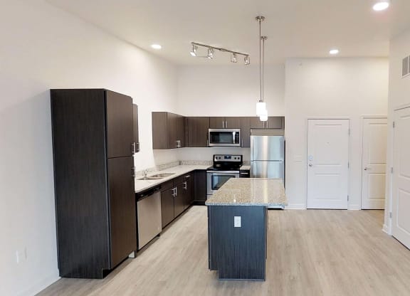 a kitchen with stainless steel appliances and a counter top