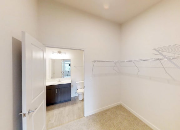 a bathroom with a shower and a sink and a toilet
