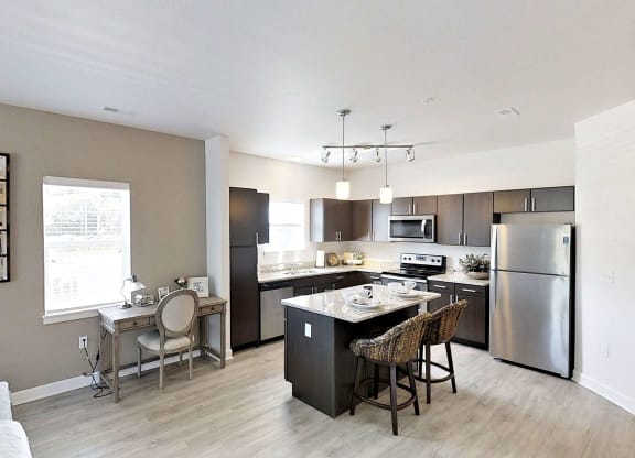 a kitchen with stainless steel appliances and a counter top