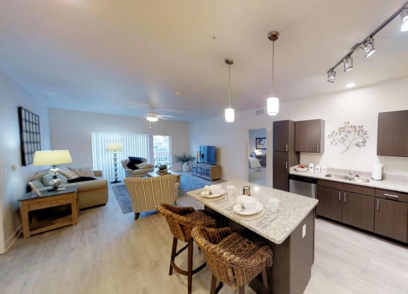 a kitchen and living room with a table and chairs