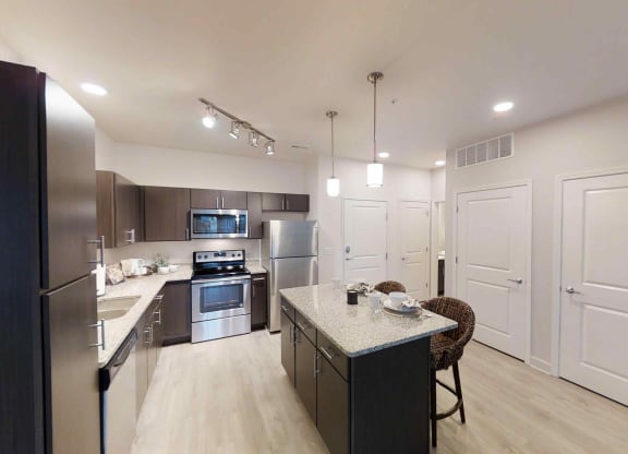 a kitchen with stainless steel appliances and a counter top