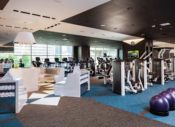 a gym with cardio machines and exercise equipment in a building at Two Lincoln Tower, Bellevue, WA
