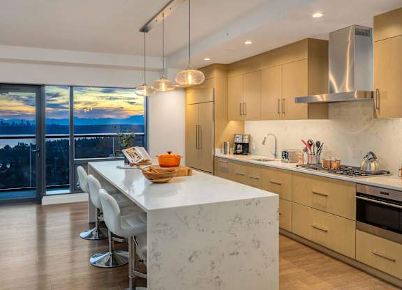 a kitchen with a marble counter top and a large window at Two Lincoln Tower, Bellevue, 98004