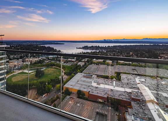 A view from Two Lincoln Tower looking down at a cityscape with a body of water in the distance.