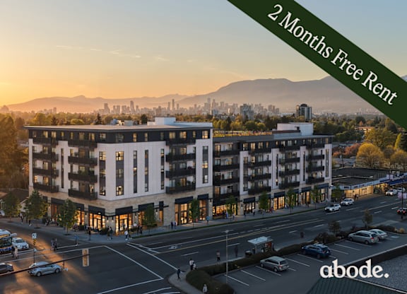 A modern apartment building with a 2 months free rent offer.