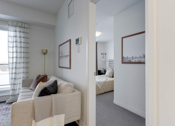 A bedroom with a bed and a couch.