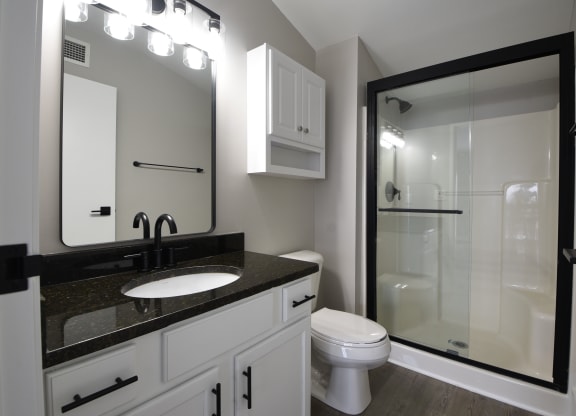 a bathroom with granite counter tops at Marshall Place, Cleveland
