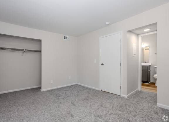 A room with a grey carpet and white walls. at Commons At Waters Edge, Columbus Ohio