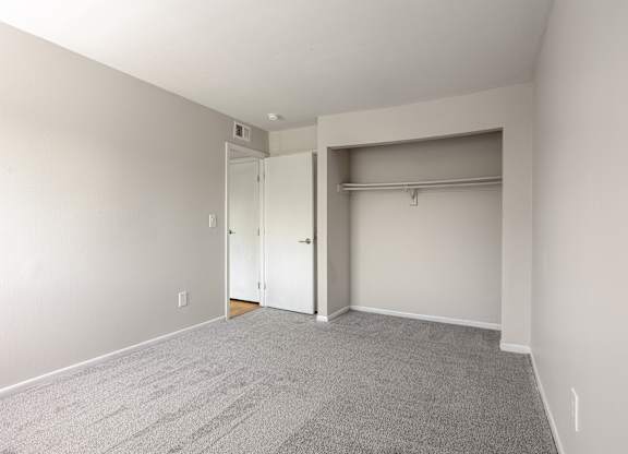 A room with a carpeted floor and white walls. at Commons At Waters Edge, Columbus Ohio
