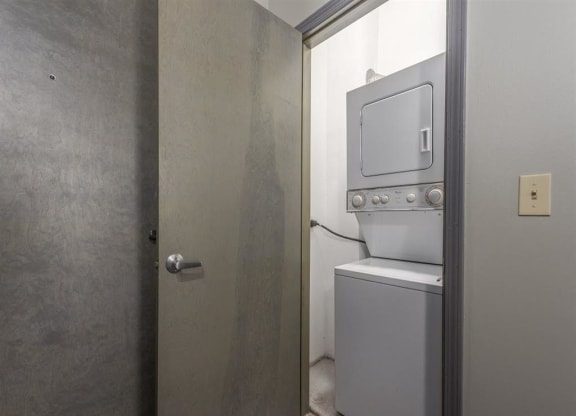 a small laundry room with a washer and dryer
