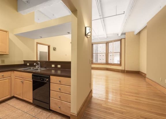 a kitchen with a stove top oven next to a doorway