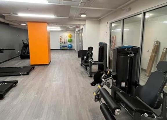 a room filled with lots of exercise equipment
