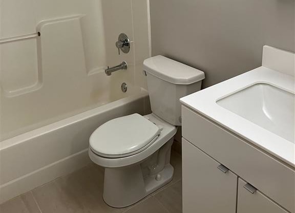 a bathroom with a toilet sink and bathtub