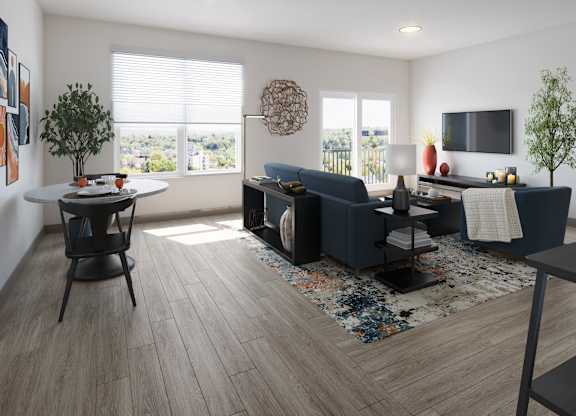 A modern living room with a large window with a view of the Cleveland