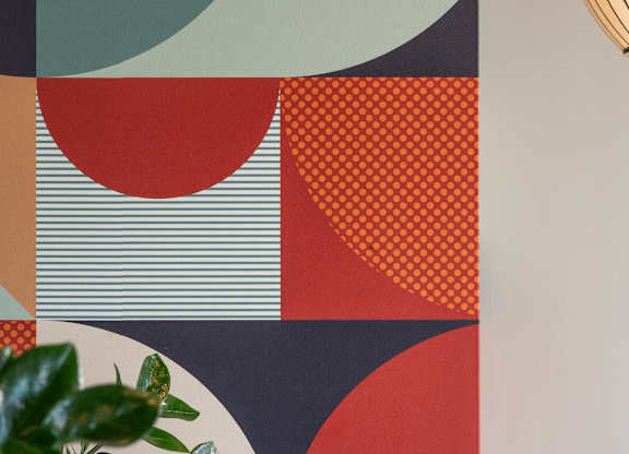 A plant sits in front of a wall with a geometric pattern at The Park Apartments, Ohio
