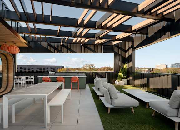 A modern outdoor seating area with white furniture at The Park Apartments, Cleveland , Ohio