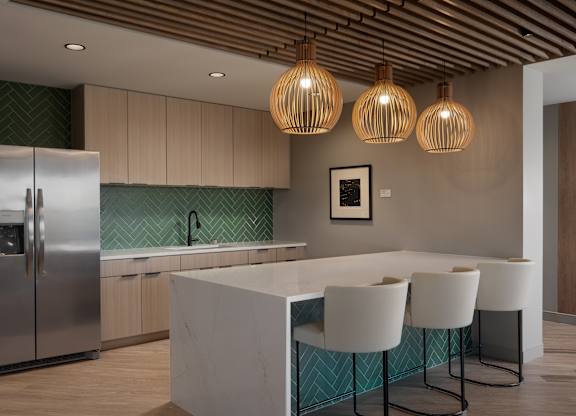 A kitchen with a white island and a refrigerator at The Park Apartments, Cleveland , OH, 44113