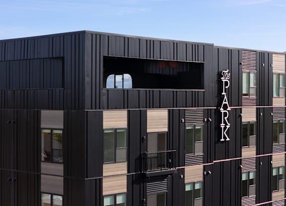 A black building with the word "PARK" on it.