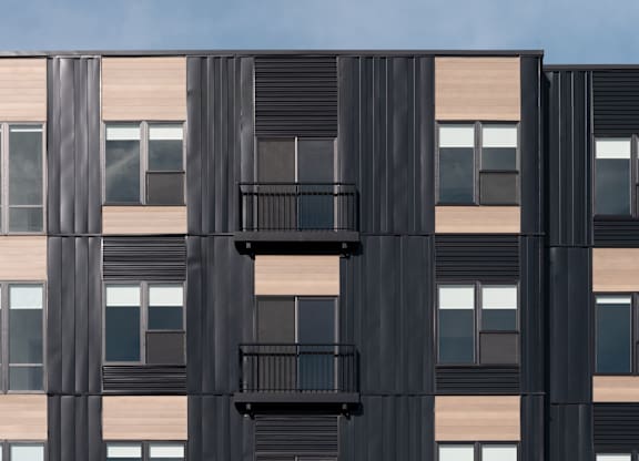 A black and beige building with balconies at The Park Apartments, Cleveland