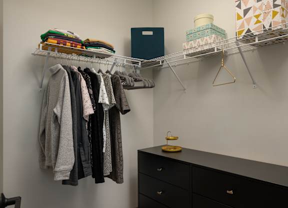 Clothes hanging on a rack in a room at The Park Apartments, Ohio, 44113