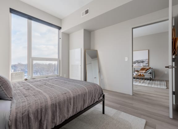 Queen bed with Cleveland city views at TREO Apartments, Cleveland