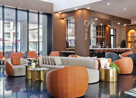 A modern living room with a large sofa and a coffee table.