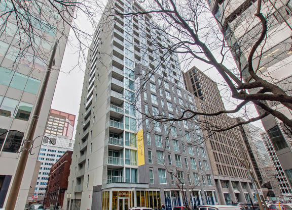a view of a tall building on a city street