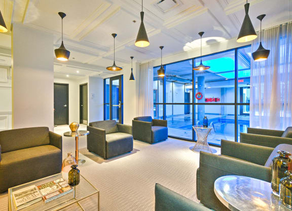 Relaxing area with chairs next to the indoor pool
