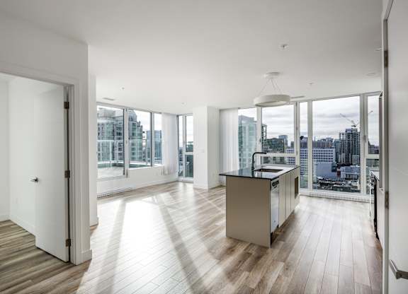 A modern kitchen with a view of the city.