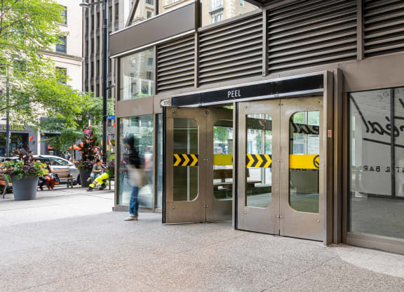 the entrance to a beta beta building on a city street