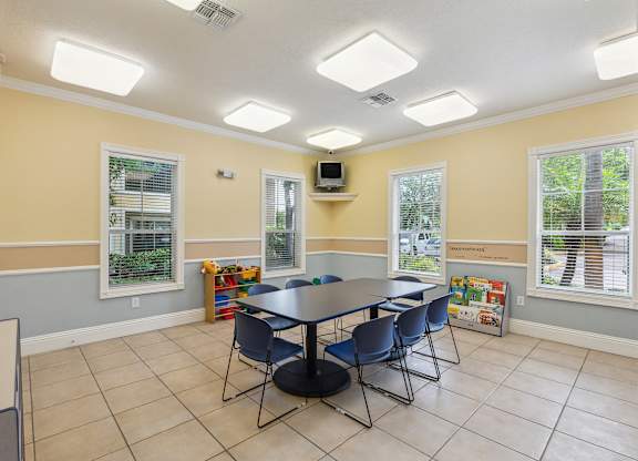 a room with a table and chairs