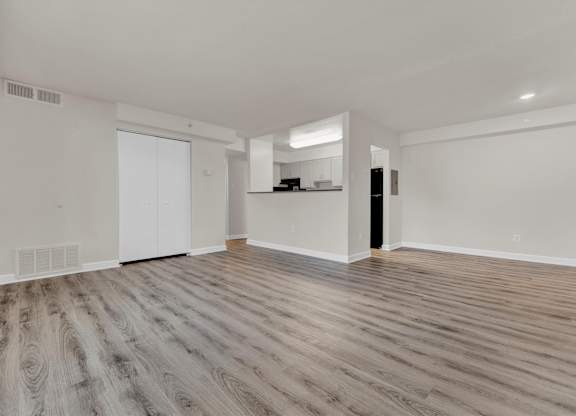 Bedroom with hardwood floors and white walls at Autumn Woods, Bladensburg, 20710